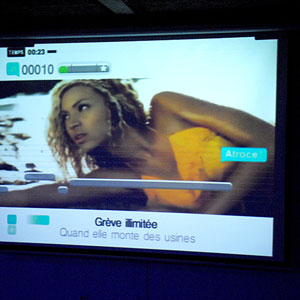 A karaoke screen displays Beyonce and some strange lyrics, likely to be transformed from the originals.